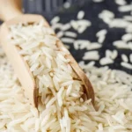 Raw basmati rice on a black wooden background royalty free stock images